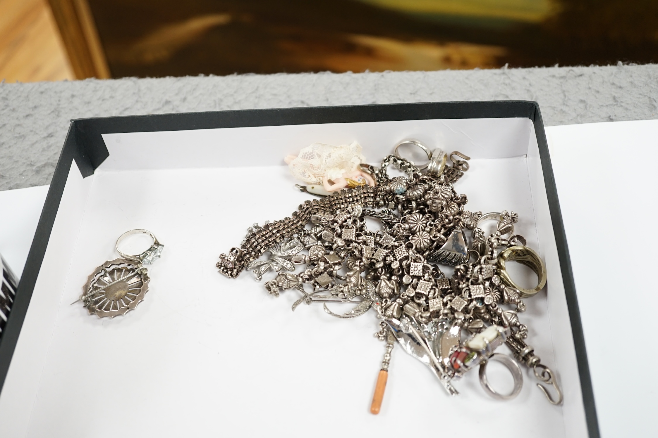 A collection of white metal and mixed costume jewellery, including bracelets, necklaces, bangles etc and a silver cased pair of scissors.